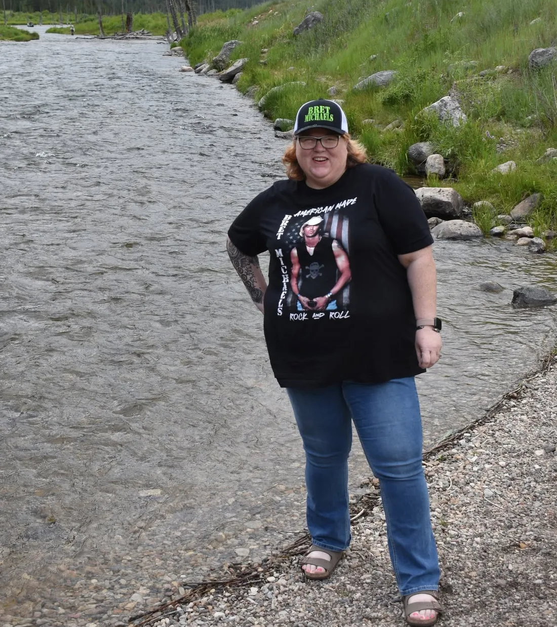 Susan Elliott beside a mountain river